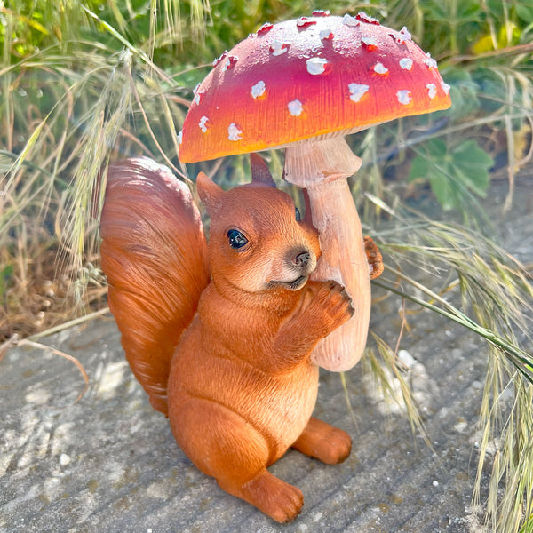 Squirrel Ornament with Red Mushroom