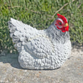 A detailed, lifelike ornament of a white chicken